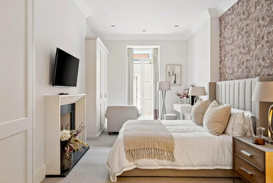 Bedroom made up with hotel linen ahead of a guest arrival